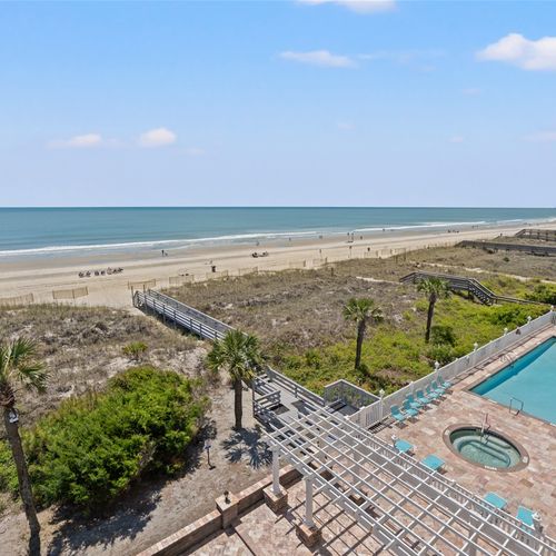Aerial view of the hot tub, pool, and beach access