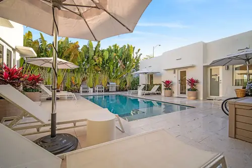 AcquaVilla pool with Tuuci umbrellas and loungers
