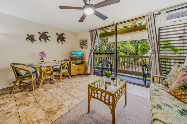 Comfortable living area with plenty of natural light and lanai access.