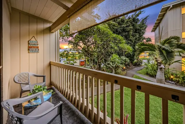 Relax on the covered lanai surrounded by tropical greenery.