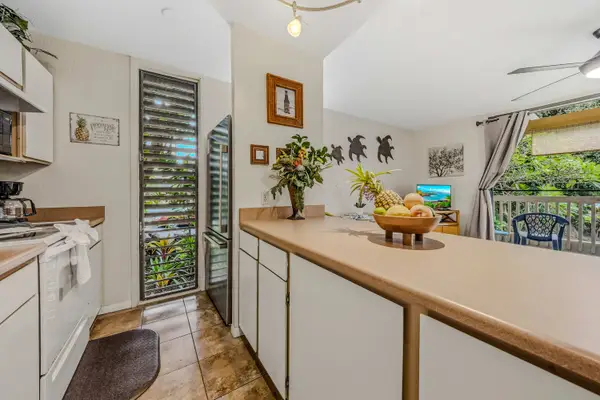 Spacious kitchen with ample counter space for cooking and dining.