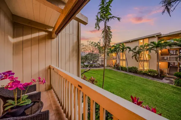 Private wooden balcony overlooking the quiet resort courtyard at twilight. 🌅🌌