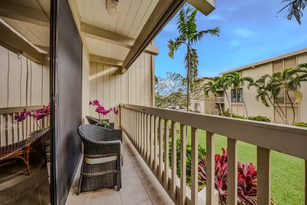 Private wooden balcony with comfortable seating overlooking the tropical courtyard. ☀️🌴