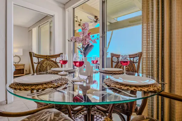 Cheers To Paradise Around An Elegant Glass Dining Table