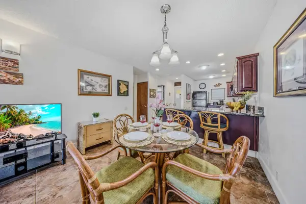 Fully set dining table and chairs in a bright, open-concept layout. 🍽️