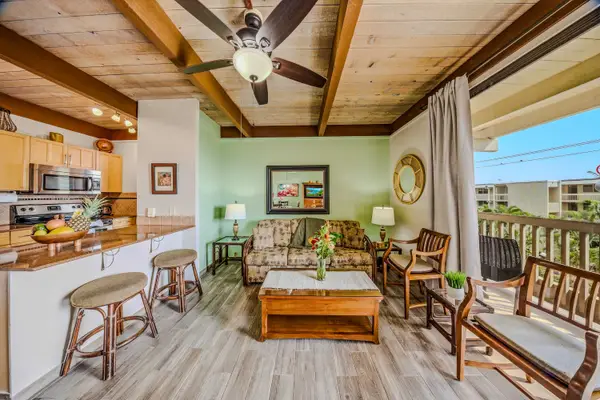 Bright Open-Concept Living Filled With Warm Island Charm