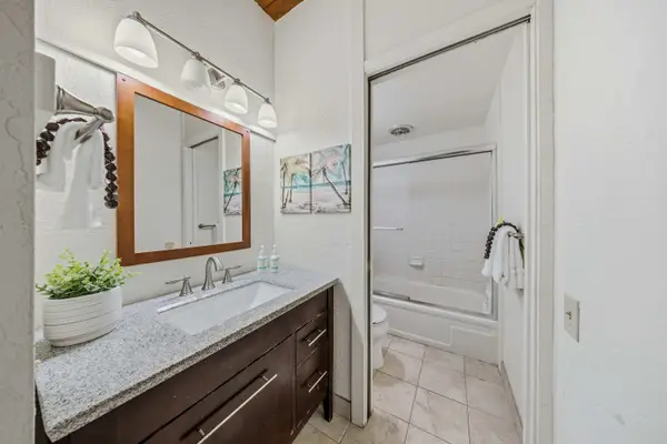 Brightly Lit Bathroom Styled with Sleek Finishes And Fresh Linens
