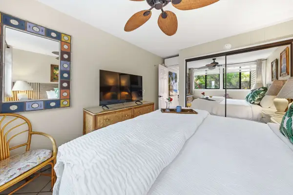 Spacious king bedroom with tropical-inspired décor