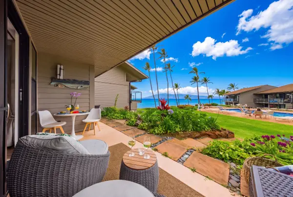 Covered lanai overlooking tropical gardens and the pool