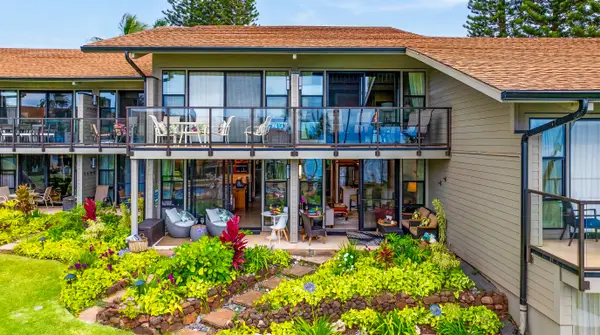 Resort-style exterior surrounded by tropical landscaping