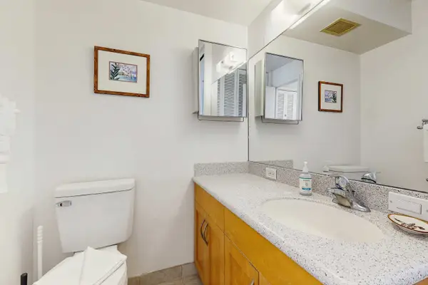 Conveniently located for guests, this half bathroom adds comfort to your stay.