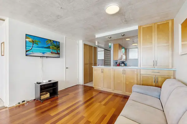 Make yourself at home in the welcoming living room, complete with a TV for relaxing downtime.