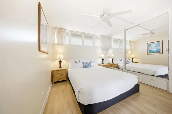 Serene Master Bedroom Retreat With Bright Mirrored Accents