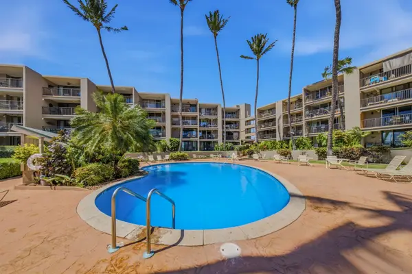 Refreshing Resort Swimming Pool Under Clear Blue Skies