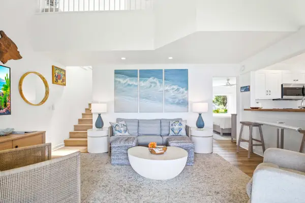 Open-concept living area with vaulted ceilings