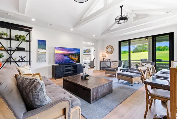 Well-lit living room with an outdoor view