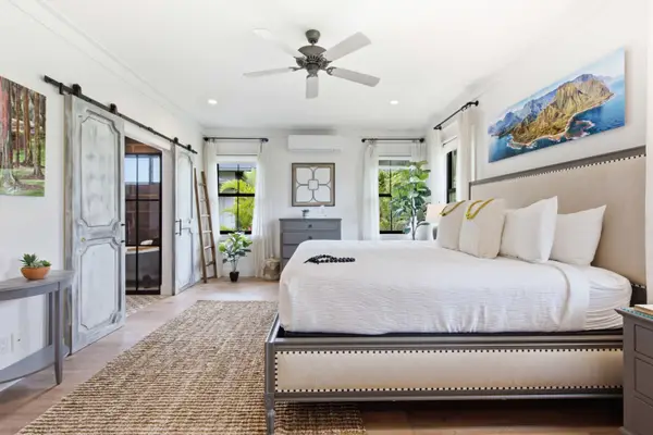Spacious, well-lit bedroom with a king-size bed on the ground floor