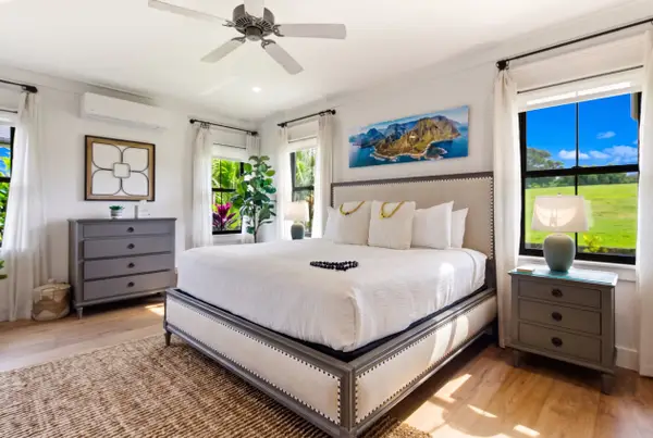 Spacious, well-lit bedroom with a king-size bed on the ground floor