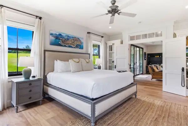 Spacious, well-lit bedroom with a king-size bed on the ground floor