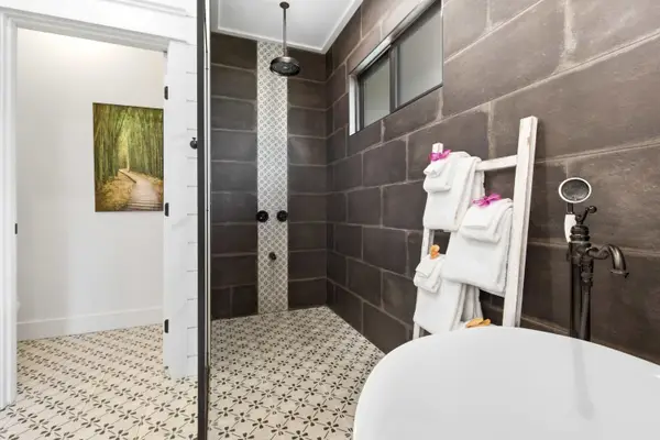 Walk-in shower with waterfall shower head