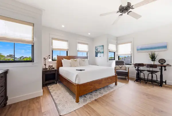 Well-lit room with a king sized bed