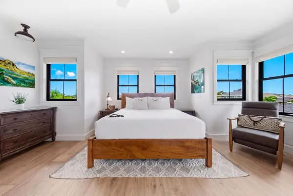Well-lit room with a king sized bed