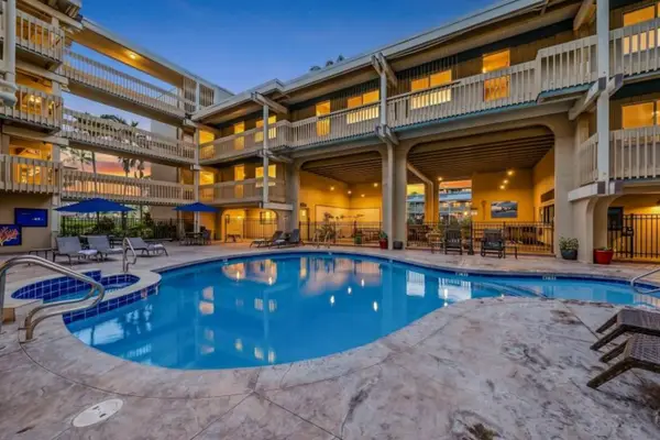 Illuminated Resort Pool and Multi-Level Complex at Dusk