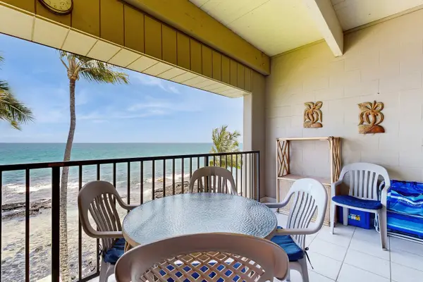 Covered Patio Dining Table with Panoramic Ocean and Beach Views