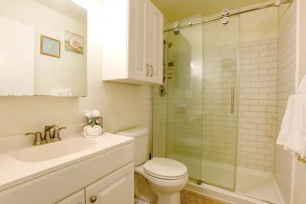 Bright Bathroom With A Refreshing Walk-In Shower