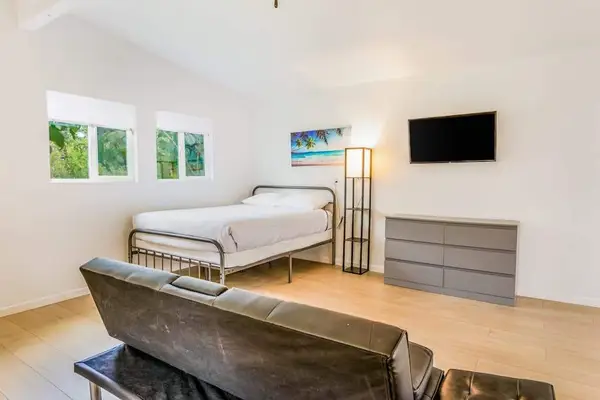 Studio with queen bed and flat screen tv.