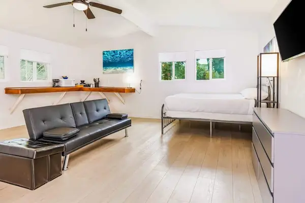 Studio with queen bed and flat screen tv.