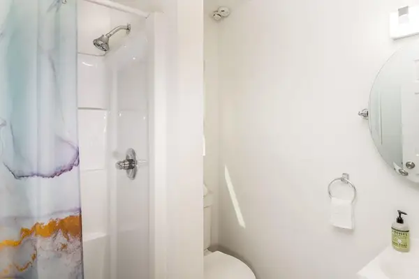 Full bathroom with walk-in shower.