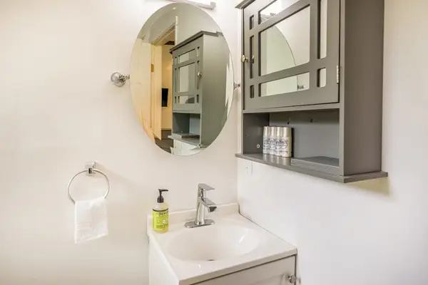 Full bathroom with walk-in shower.