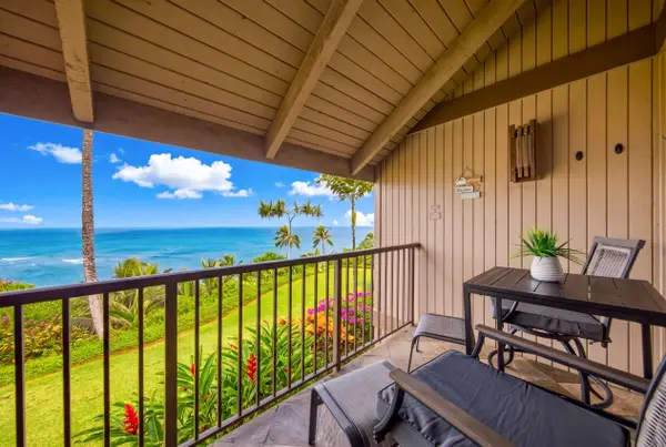 Breezy lanai creates a setting for outdoor meals above gardens