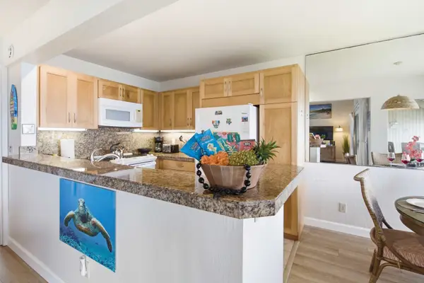 Bright kitchen offers practical workspace, useful equipment, and convenient storage