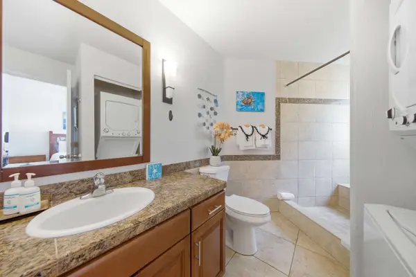 Bright bathroom includes practical amenities, polished surfaces, and updated fittings