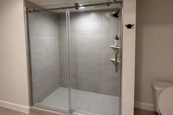 Bathroom includes modern fixtures  and a refreshing shower
