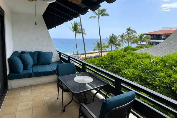 Covered balcony offers seating with island views and tropical breezes