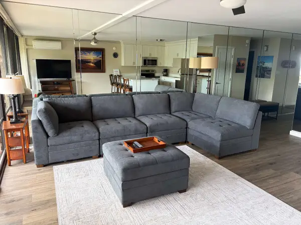 Spacious living room with comfortable seating to relax after a day at the beach