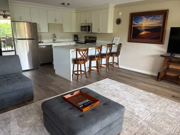 Modern Kitchen and Island Bar Area Overlooking Living Space