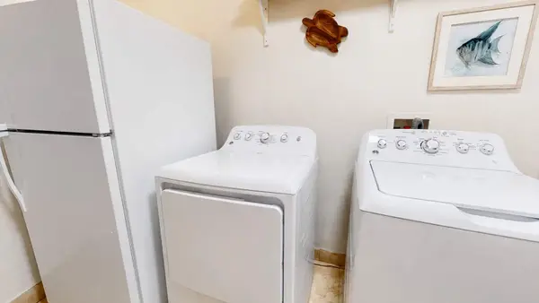 Classic top-loading washing machine and a front-loading matching clothes dryer for all your clothes cleaning needs.