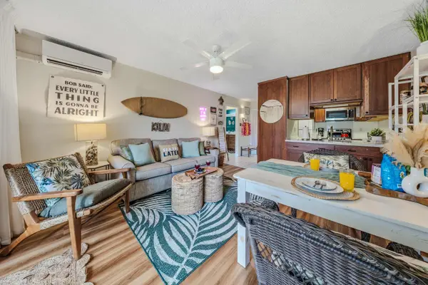 Open-Concept Living Suite with Sofa, Dining Table & Kitchen