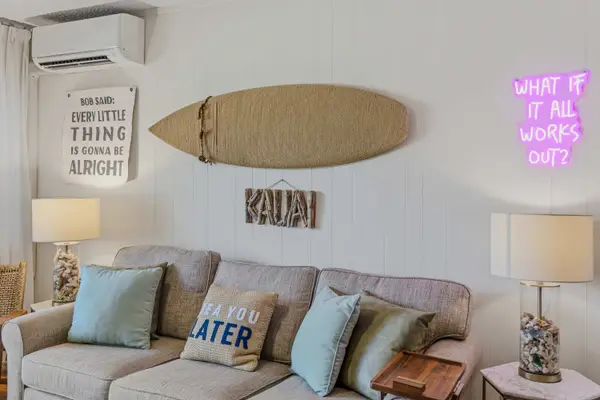Living Room Sofa Wall with Coastal Décor & AC Unit