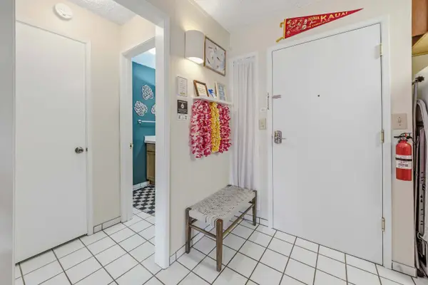 Entryway bench with view to bathroom door
