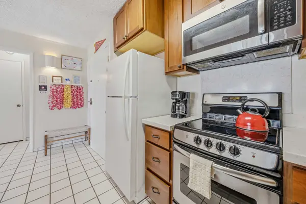 Cooking area with appliances & fridge