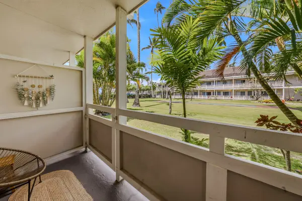 Private upper-level covered lanai with garden views