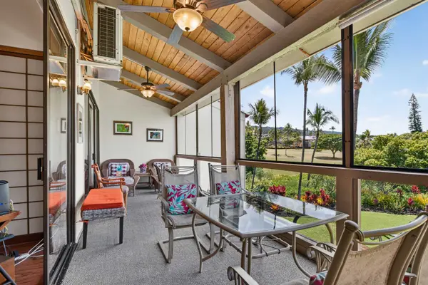 Covered balcony with outdoor seating and scenic views