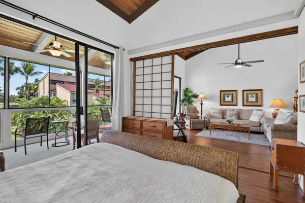 Bedroom with king bed opening to direct lanai access and living area