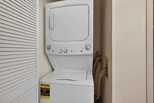 In-unit stacked washer and dryer in laundry closet