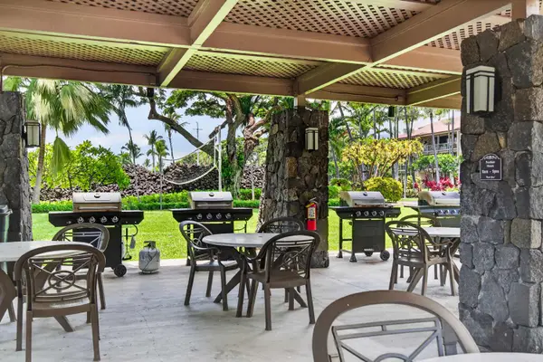Community BBQ grilling station and covered patio dining area